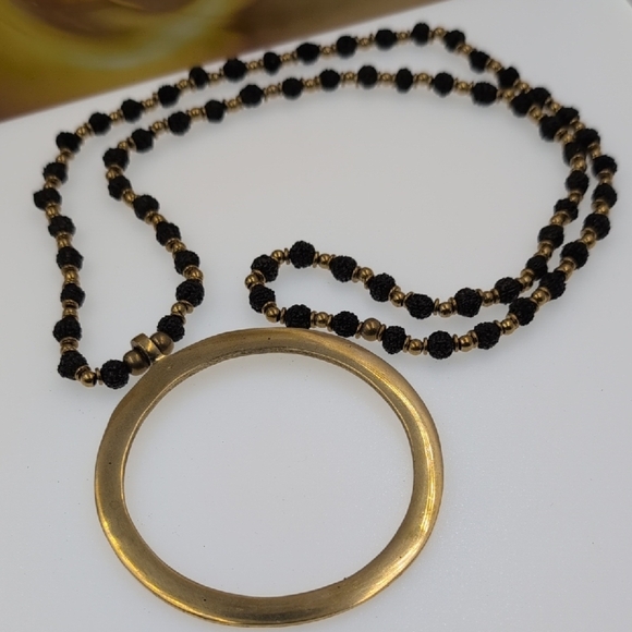 Nataraj Elegant Gold and Black Necklace with Circular Pendant - Picture 2 of 6
